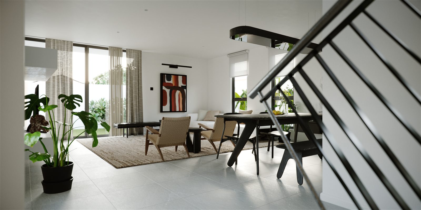 The same room from the dining end, with the stair's metal railing crossing the foreground and the red abstract painting lit on the far wall.