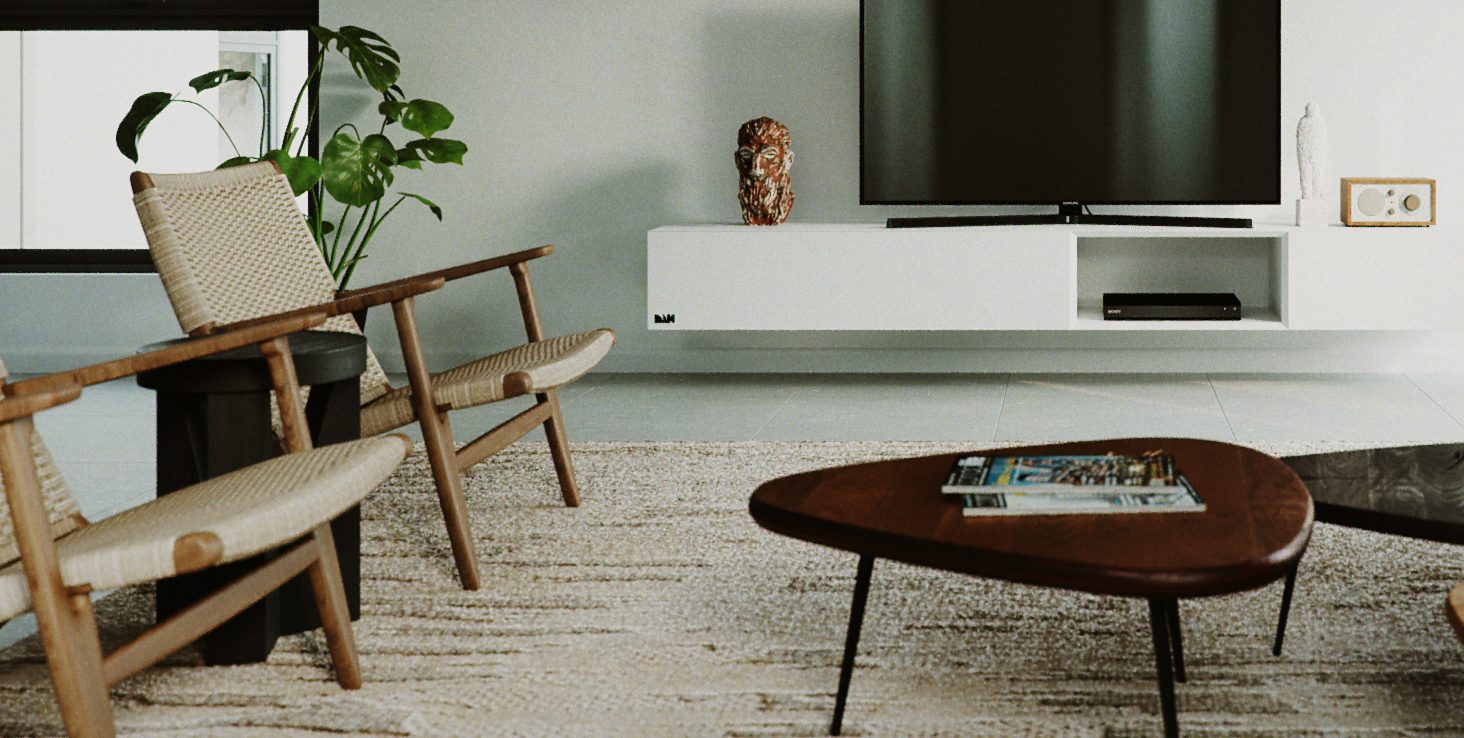 Crop across the lounge chairs and the low table, with the television and the white media wall behind.