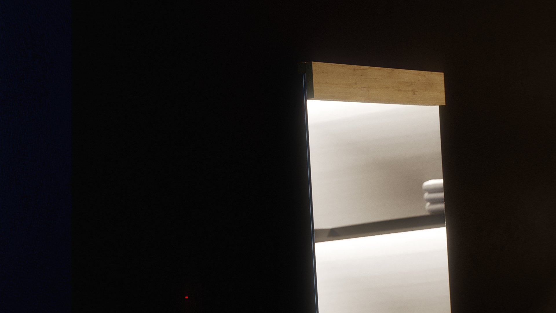Ahero mirror detail in near darkness: only the oak head cap and the narrow edge of the glass catch the light, a white bed and folded towels floating in the reflection.
