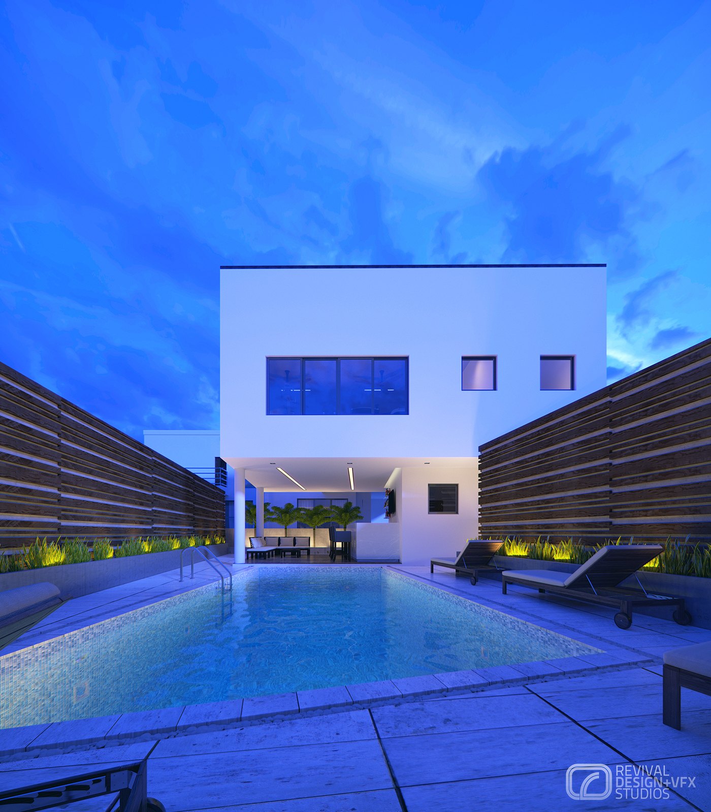 Dusk view across a rectangular pool lit pale blue, a white two-storey villa glowing behind it, timber slat screens enclosing both sides and two loungers on the stone coping under a deep evening sky.