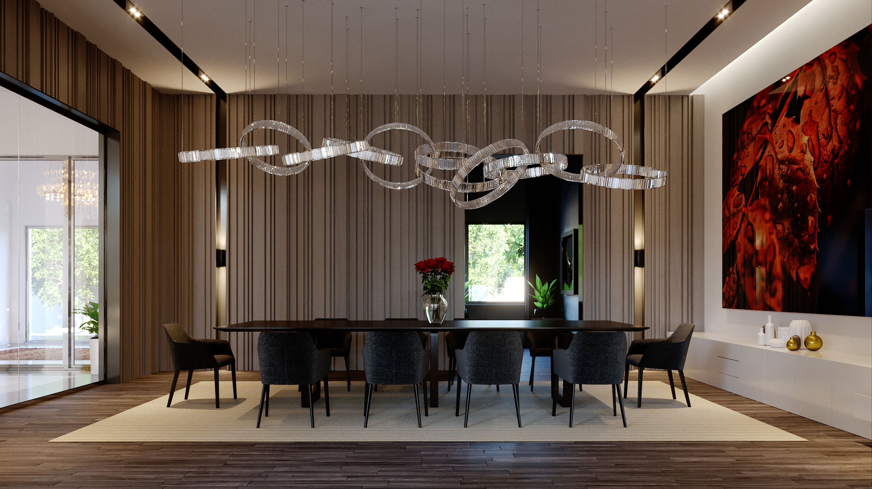 The dining room: a long dark table ringed by grey upholstered chairs beneath a ring-form crystal chandelier, vertical timber battens across the back wall, a red abstract canvas at the right and glazed doors onto the garden at the left
