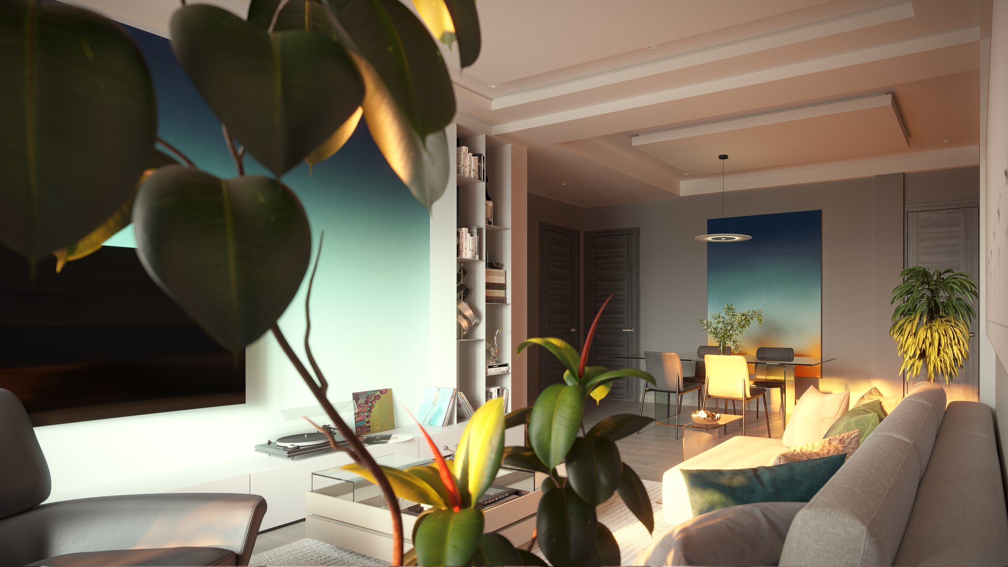 Avalon living room at dusk from behind the sofa, framed by blurred plant leaves: the television on its blue-green gradient panel above a low white console with a turntable and leaning vinyl sleeves, dining table beyond and teal and ochre cushions.