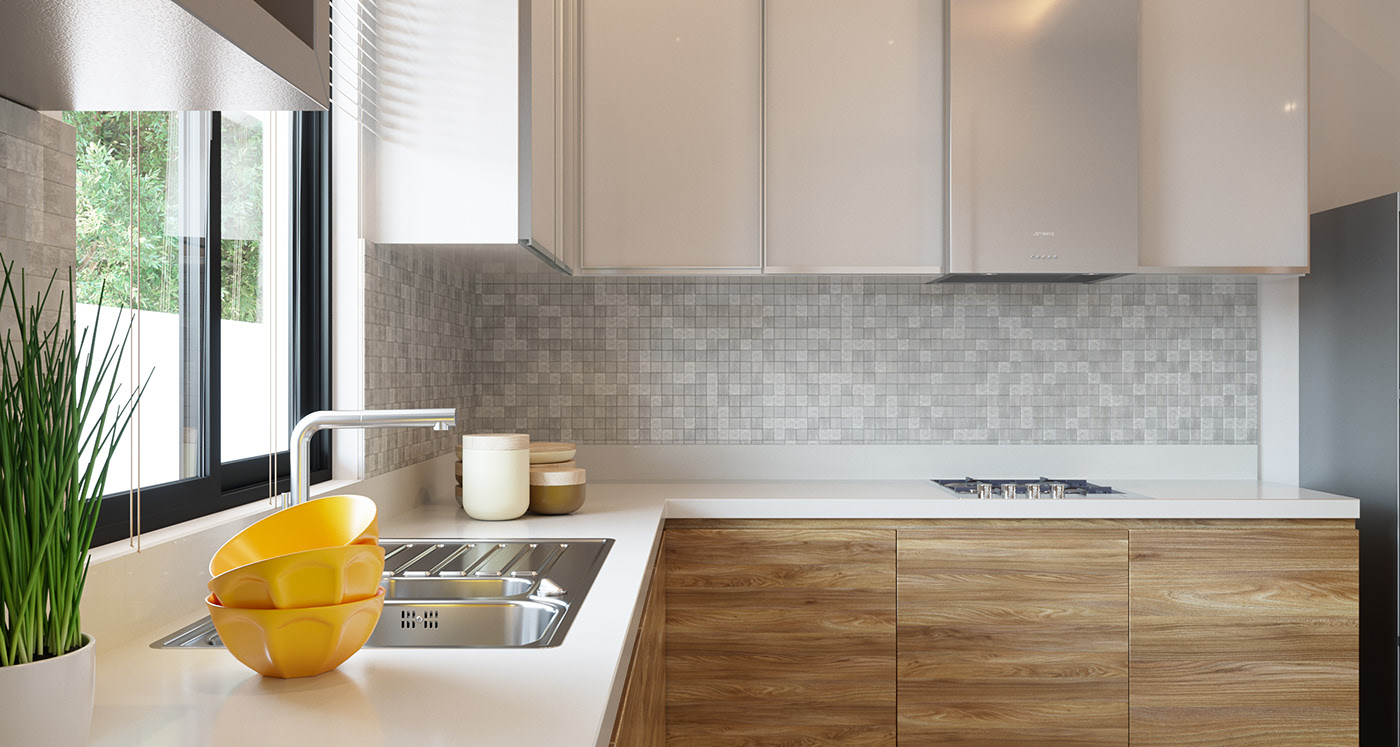 BFA kitchen at counter height: glossy taupe wall cabinets and a steel hood over a grey mosaic backsplash and white worktop, oak veneer bases, three stacked yellow bowls, a tall chrome tap and a black-framed window on greenery.