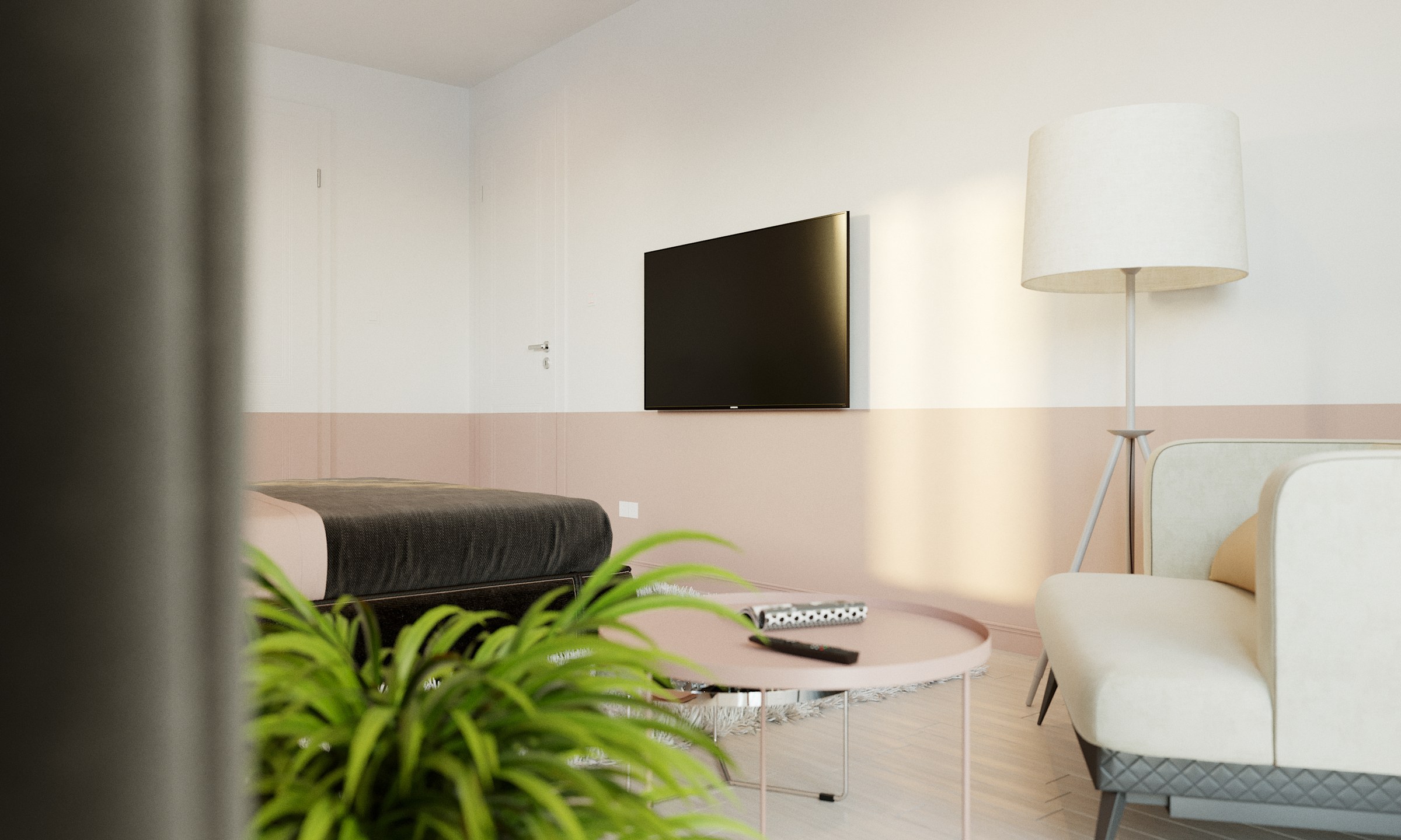 BFA bedroom from the opposite corner, framed by a blurred wall edge and out-of-focus plant: the black television on a split white and pink wall, a cream armchair on a quilted grey base and a tripod floor lamp with a drum shade.
