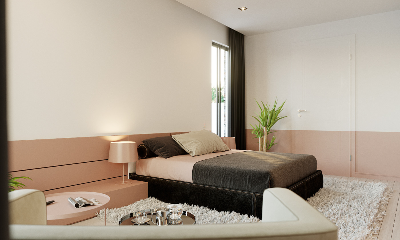 BFA bedroom behind the cream sofa back that spans the foreground: pink headboard panel, pink lamp on a block nightstand, a chrome tray of glass tumblers on the shag rug and a dracaena in a black pot by the dark curtains.