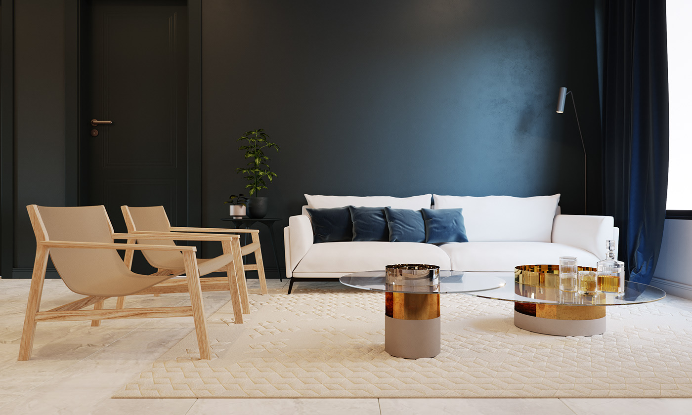BFA living room with a white sofa and navy cushions against a dark feature wall, two oak lounge chairs, and a glass coffee table on polished brass drum bases over a cream quilted rug