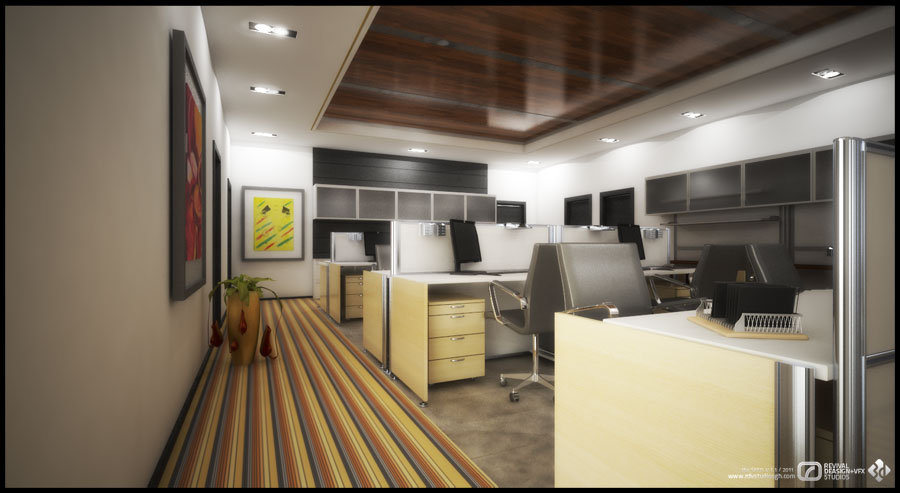 The open-plan back office: bays of pale maple desk with grey privacy screens and drawer pedestals, each set with a black monitor and telephone, run beneath a long band of dark grey overhead cabinets. A chrome-framed grey task chair stands at the nearest bay and a chrome post rises in the right foreground. A striped runner of mustard, red and grey carpet leads down the left side past two framed abstract panels and a plant in a tall pot, under a recessed dark wood ceiling panel set with downlights.