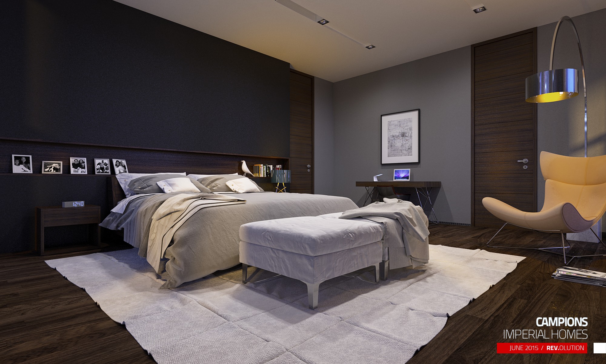 A bedroom with a dark headboard wall carrying framed photographs, a bench at the foot of the bed and a yellow chair