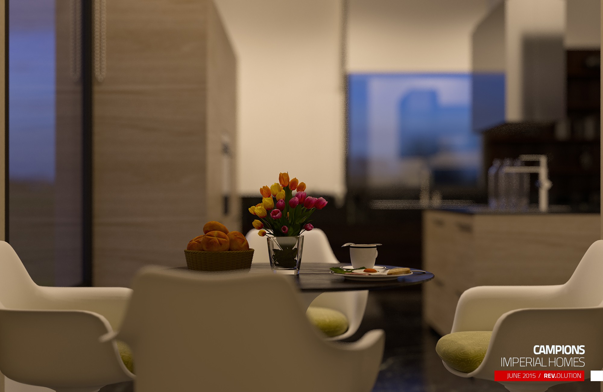 The kitchen close over the island, with cream chairs pulled up to it and a bowl of flowers on the counter