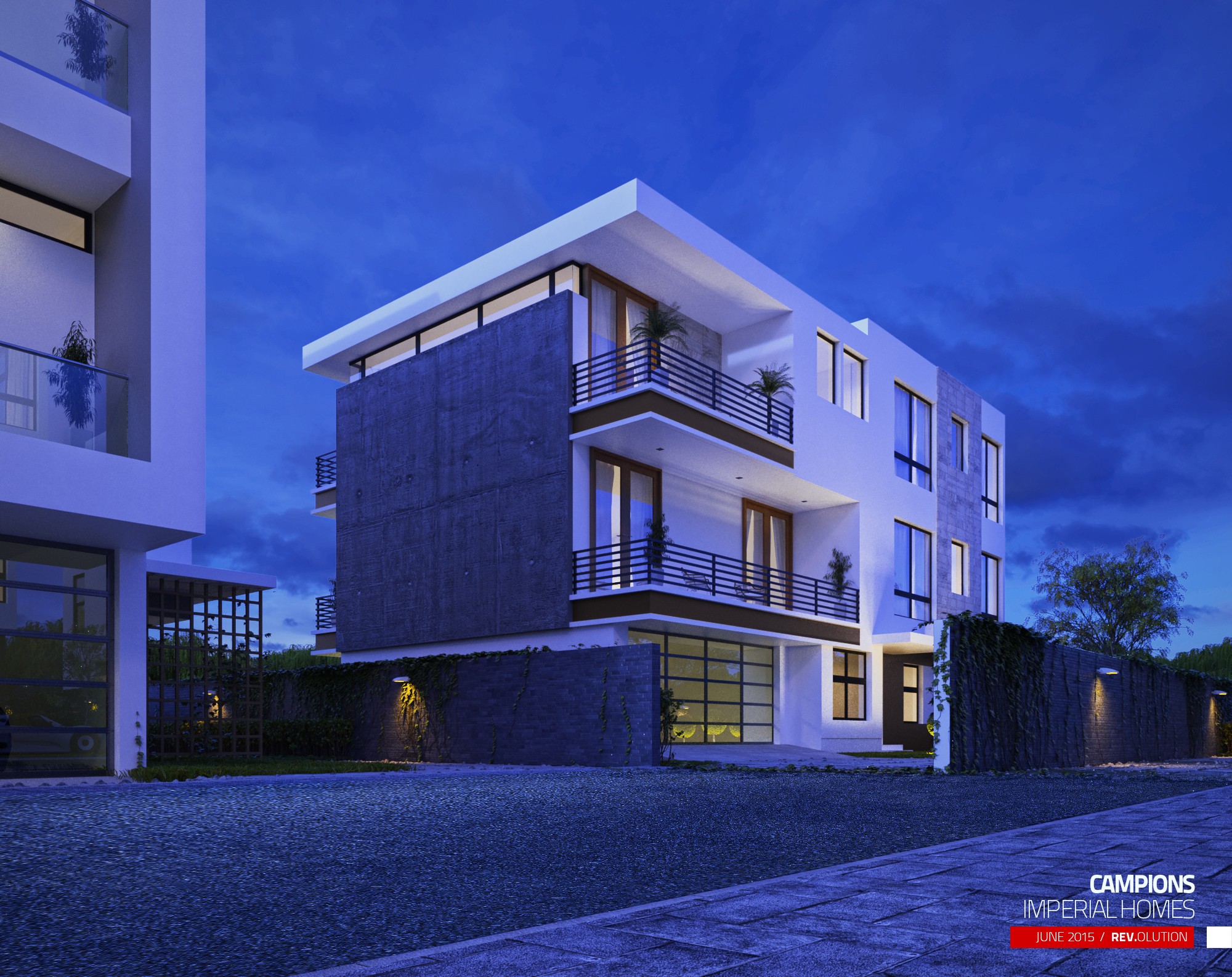 An exterior at dusk: a white house with a stone-clad corner and lit balconies against a deep blue sky