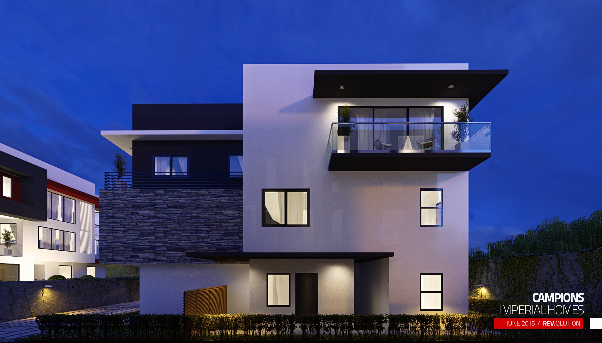 An exterior at dusk: a white house with a black roof fascia and a stone band, lit windows and a hedge along the front