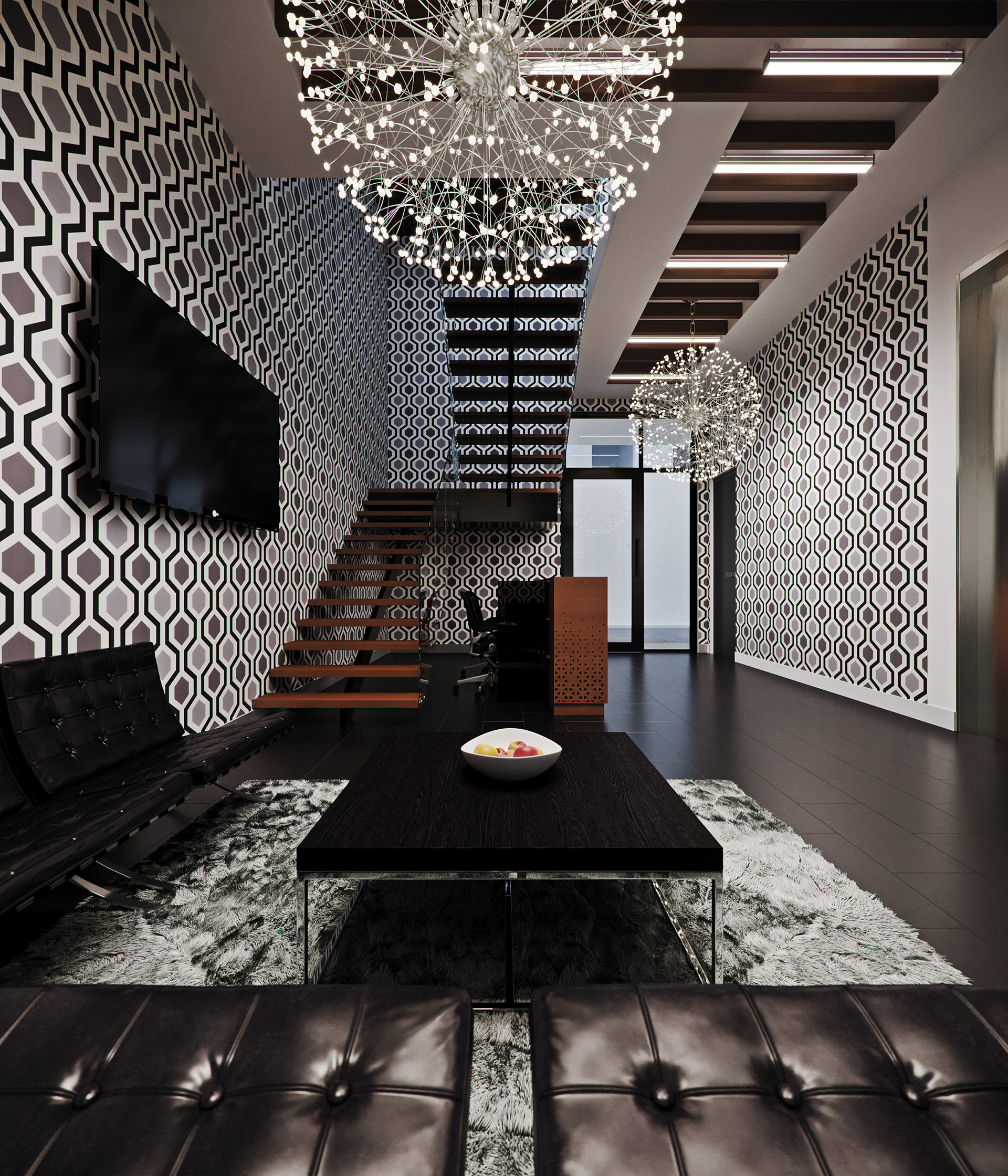 West Cantonments Residence lounge from seated height behind a black leather sofa: tufted Barcelona-style seating, a dark oak table with a bowl of red and yellow apples on grey shag, hexagonal wallpaper and two dandelion crystal ball chandeliers over a floating stair.