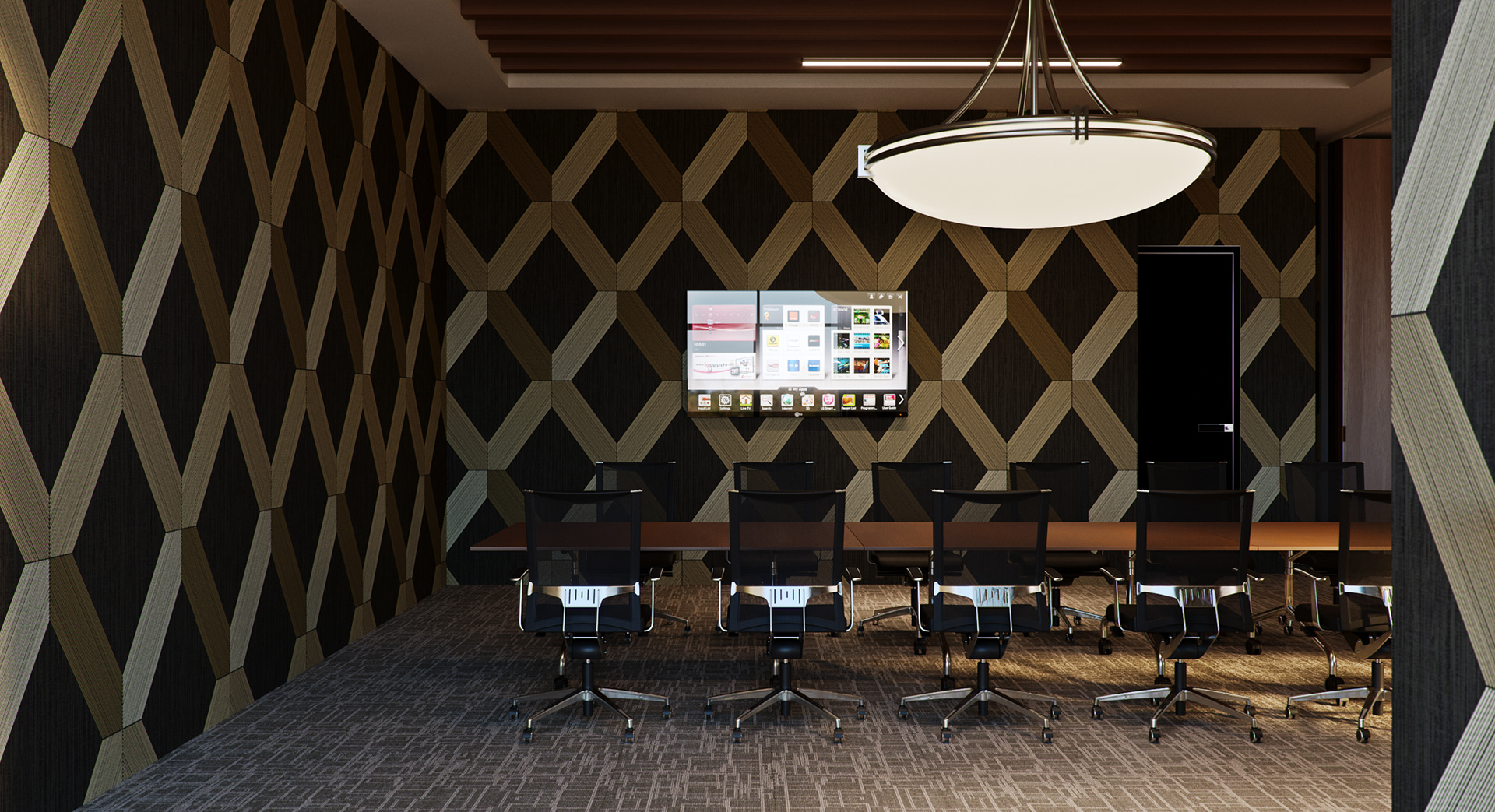 West Cantonments Residence boardroom from one end: a long wood table with black mesh task chairs on chrome bases, charcoal-and-gold diamond panelling behind the wall-mounted screen and a large oval disc pendant above.