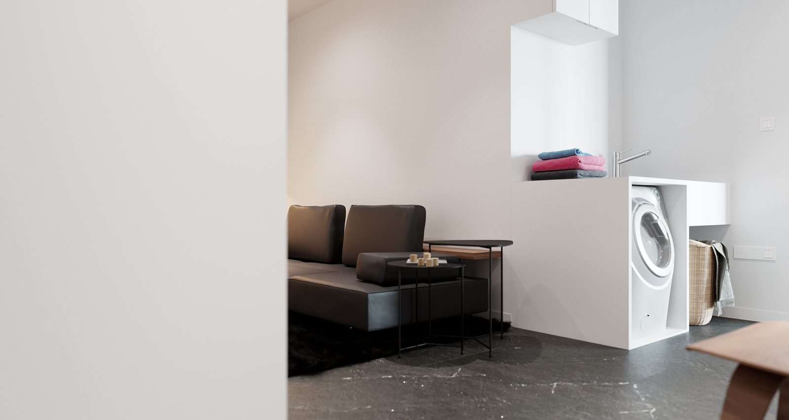 Tower Cascades - Lounge corner with a built-in laundry niche: a washing machine and folded towels set into white joinery beside the end of the sofa.