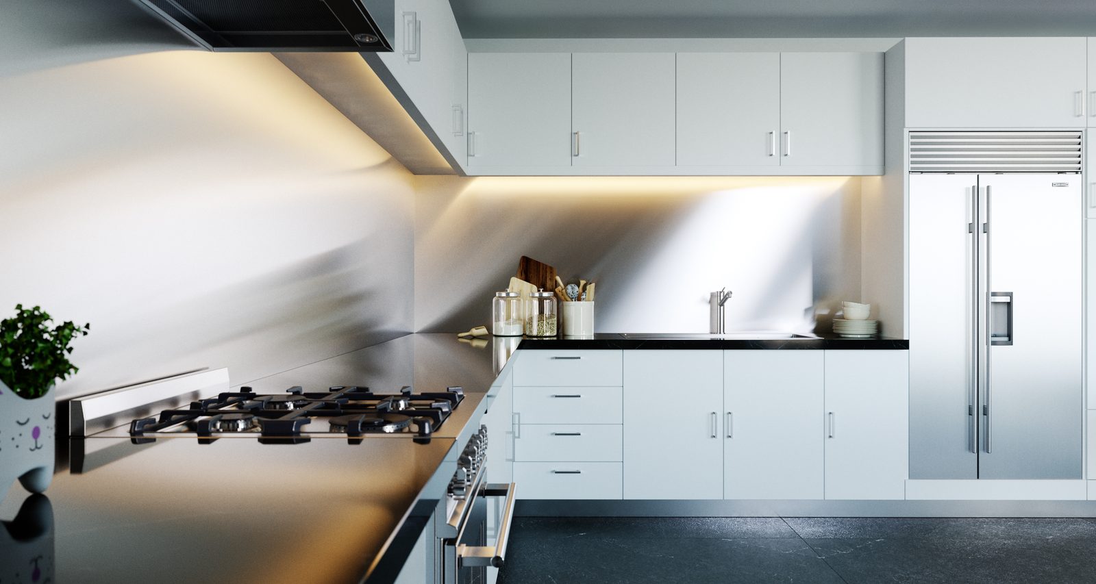 Tower Cascades - Kitchen: white handleless cabinets and drawers, a stainless extractor over a gas hob, and a tall integrated fridge at the far end of the worktop run.