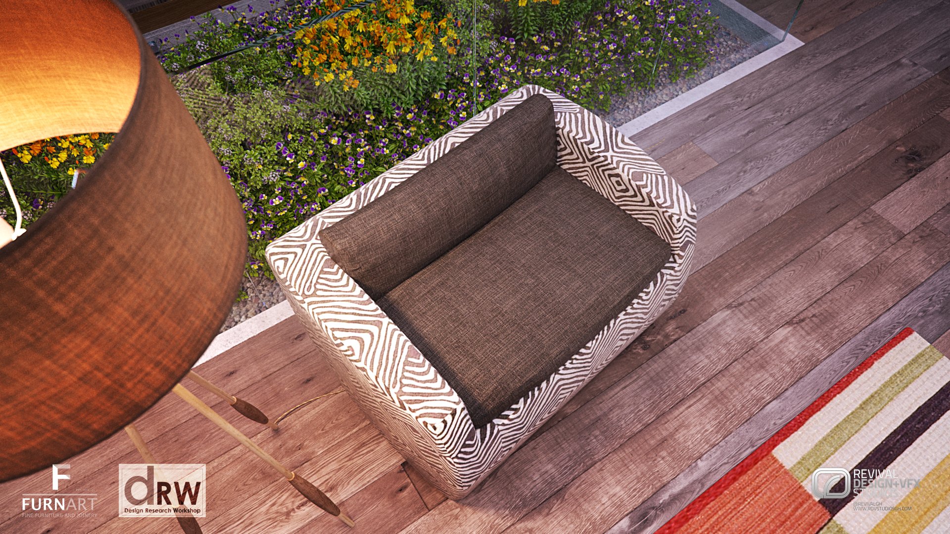 The patterned armchair seen from above on a timber deck beside a planted bed, with the drum shade of the floor lamp at the edge of frame