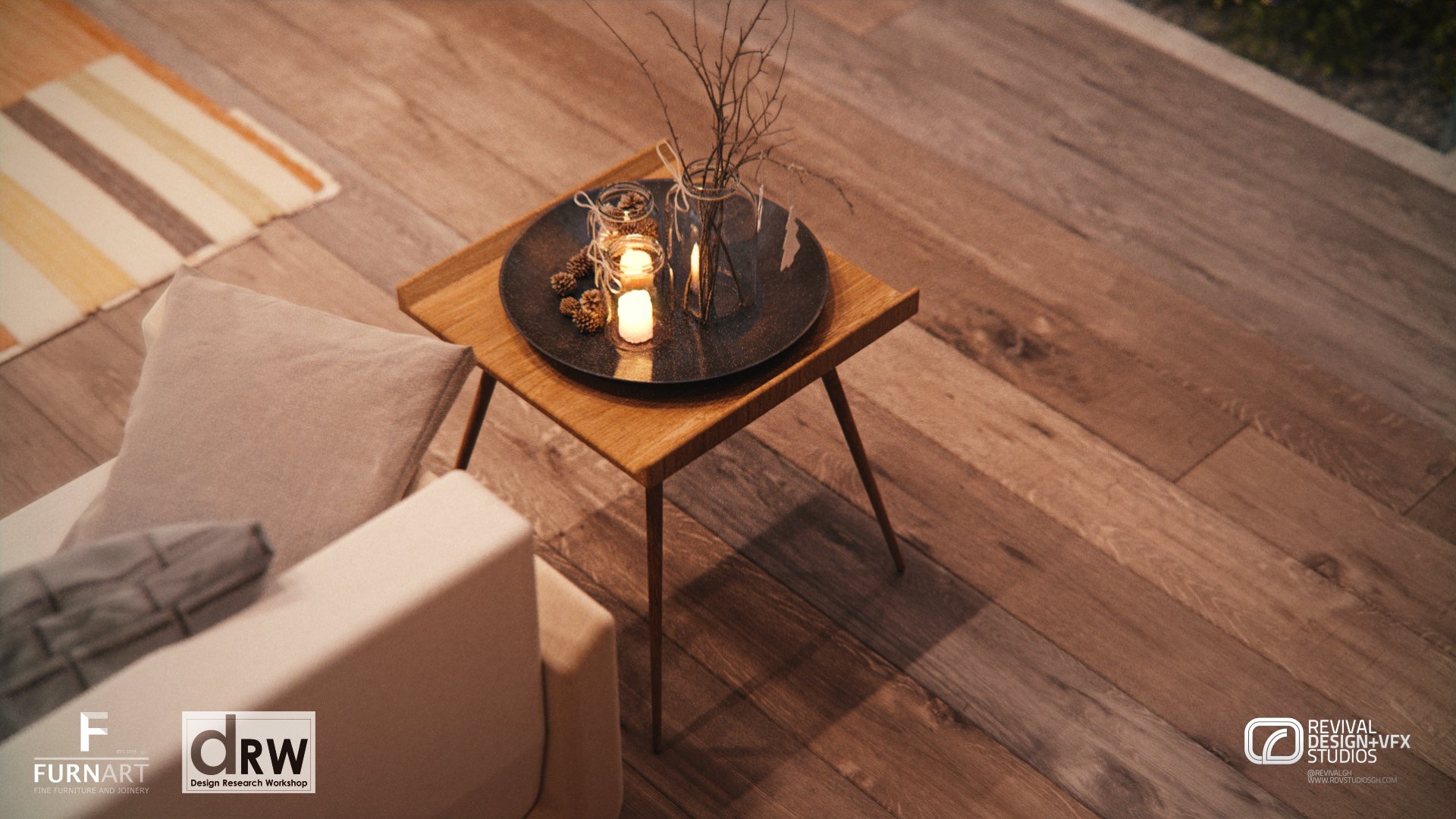 Close-up from above of a splayed-leg timber side table carrying a tray with lit candles and a vase, beside a cream sofa on a dark wood floor