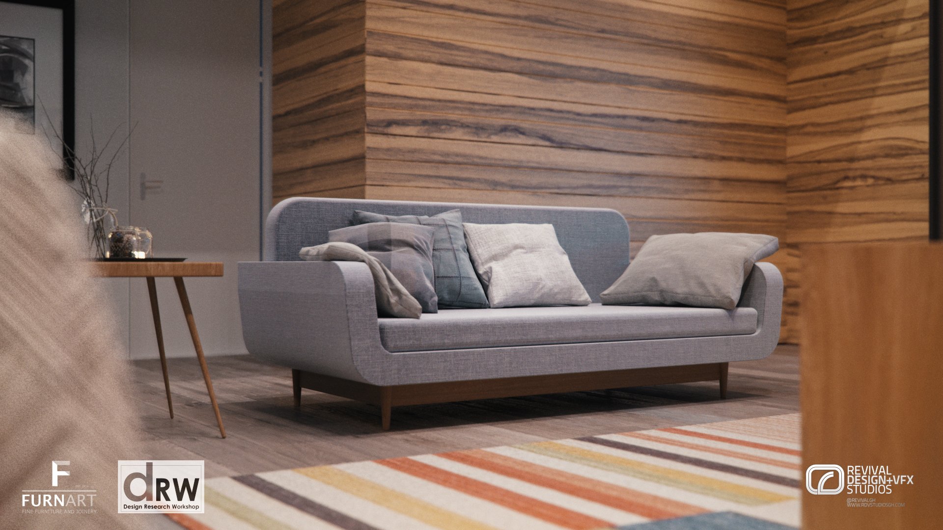 The grey sofa in the living room against the timber wall, with a side table and the striped rug in front