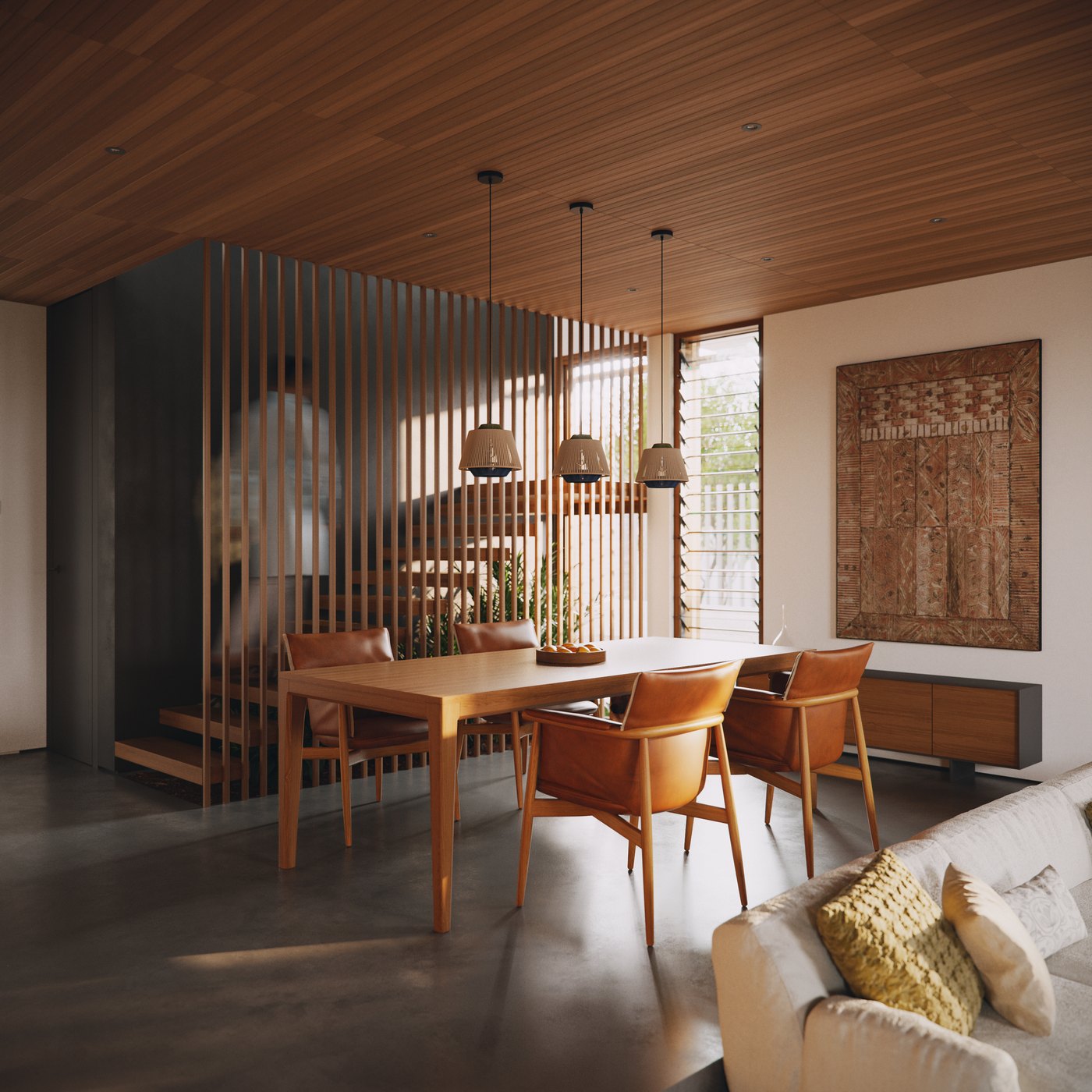 The dining table from the living side: four leather chairs under a row of three fabric-shade pendants, the floating stair and a planted trough visible through a dark volume wrapped in vertical timber slats with the sun striping through them, louvred glazing to the garden beyond, and a large bark-cloth canvas hung above a low sideboard on the right.