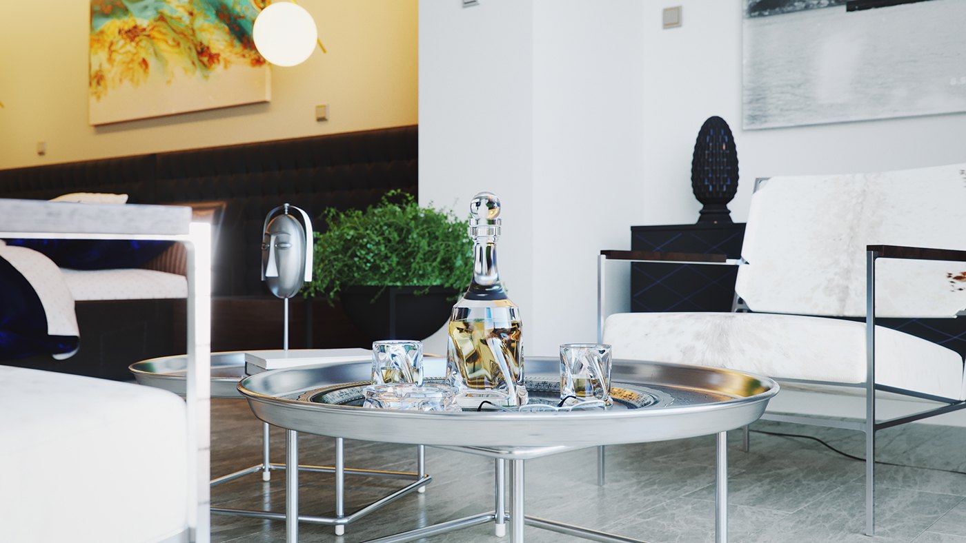 A rendered styling close-up in the guest room: a round chrome-and-glass coffee table holds a decanter and glasses, set before a white armchair and the dark headboard. A globe pendant glows at the top and an abstract painting warms the wall behind.