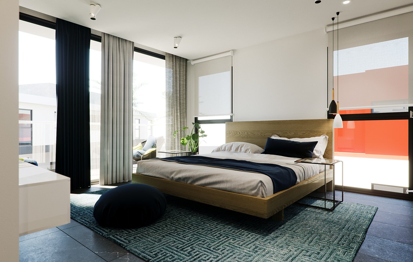Bedroom render: a low oak bed with white linen and a navy throw on a teal patterned rug, black pouf at the foot, slim glass side tables, dark curtains and an orange exterior wall visible through the glazing.
