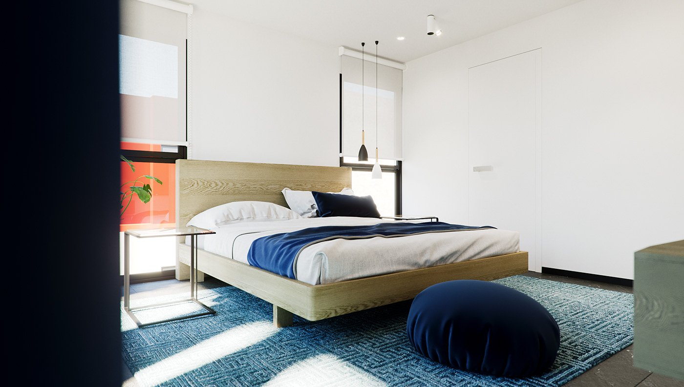 Wide bedroom render from the foot of the room: the oak bed with navy throw centred between full-height glazing and dark drapes, a black pouf on the rug, and two pendant lights hanging low at either side.