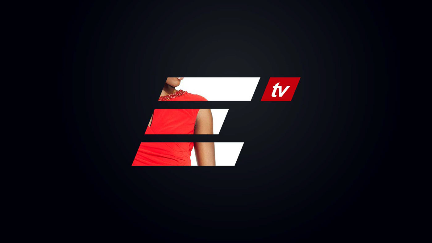 The ELO TV channel ident: three slanted white bars forming an italic E with a presenter in a red beaded dress masked inside the letterform, and a red parallelogram carrying the lower-case tv tag, set on a black field