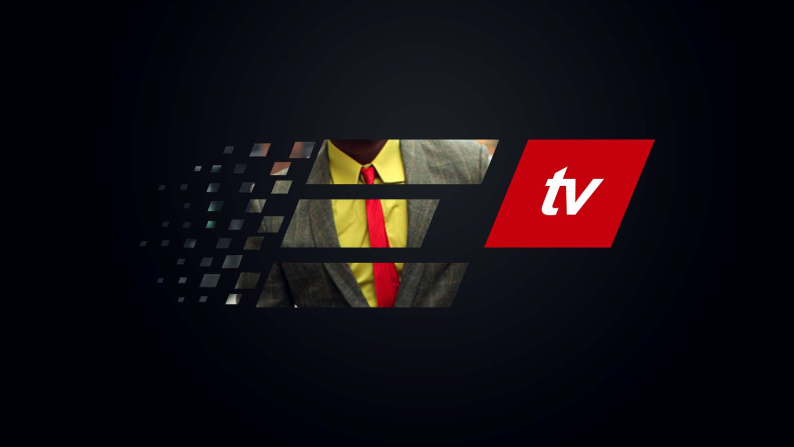 ELO TV ident frame: the letterforms used as a window onto a man in a grey tweed suit, yellow shirt and red knitted tie, cropped from the chin to the chest, with the red tv parallelogram at right.