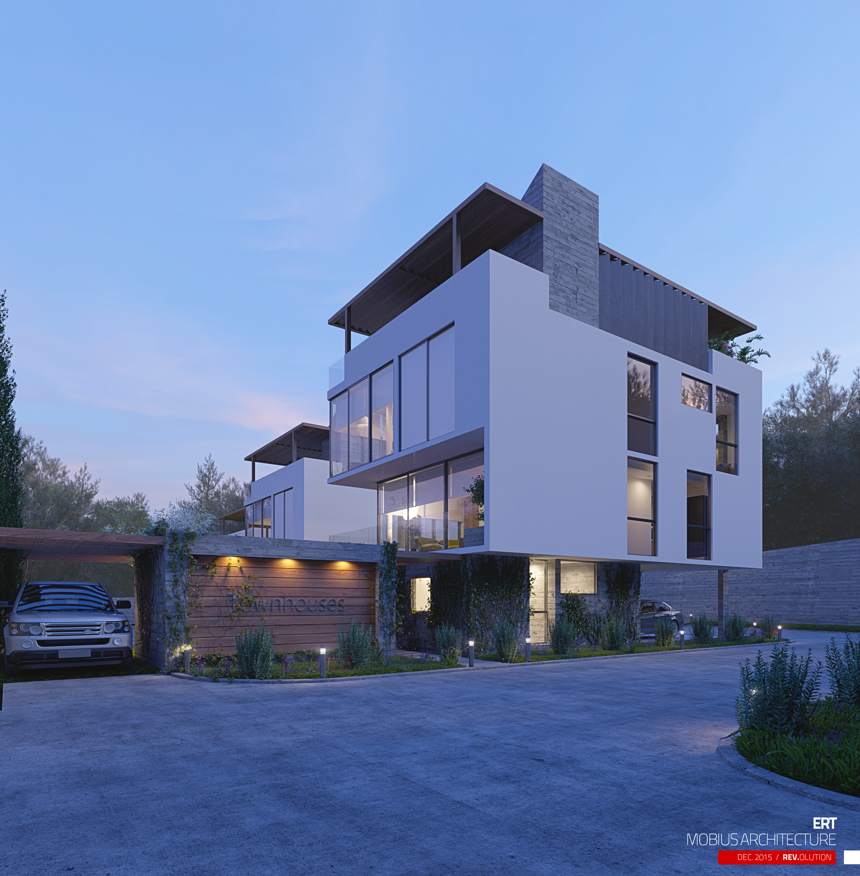 ERT corner house at dusk: the white cubic volume with its concrete chimney and full-height glazing, a timber Townhouses sign wall uplit at the left and an SUV under the carport.