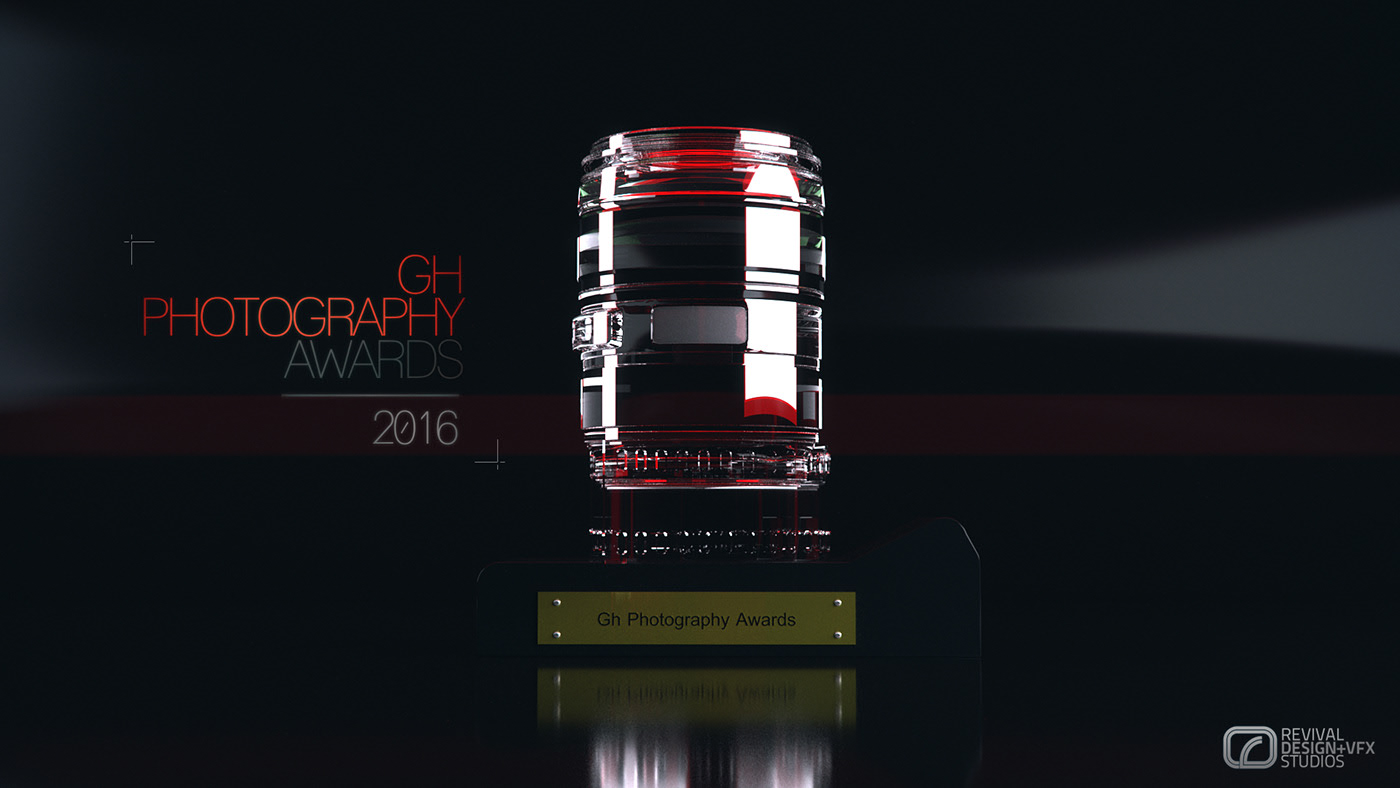 The award as a sculpture: a camera lens barrel standing on a dark plinth whose brass nameplate reads Gh Photography Awards, the glass lit red and the whole piece mirrored in the gloss black table below, GH PHOTOGRAPHY AWARDS 2016 stacked in red and grey at the left and a Revival Design+VFX Studios mark at the lower right