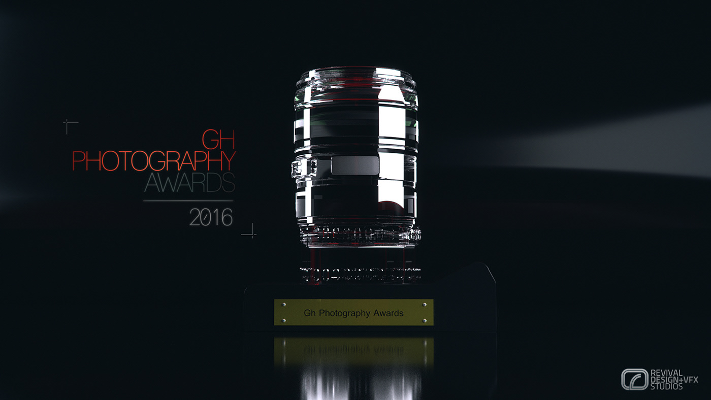 The same lens-barrel award on its nameplate plinth in a cooler pass, the glass reading silver with red only inside the barrel and the red band behind the lettering dropped out