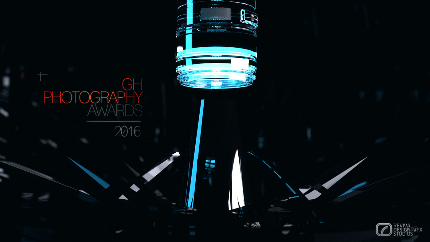 A low angle on the award: the lens barrel glowing cyan at the head of a black conical column whose base breaks into radiating chrome shards, GH PHOTOGRAPHY AWARDS 2016 set in red against the dark at the left