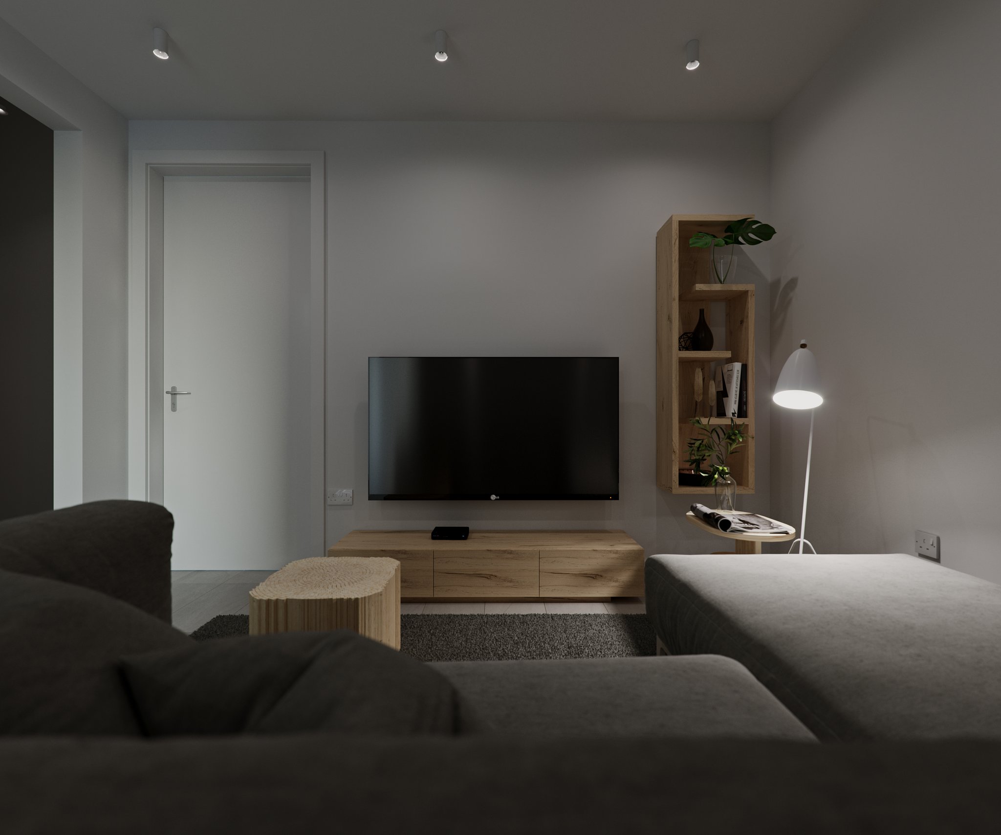 Giffard Park snug at night: wall-mounted television over an oak low sideboard, tall raw-oak open shelving with plants and books at right, a lit white cone floor lamp and a log-slab table beyond the dark sofa.
