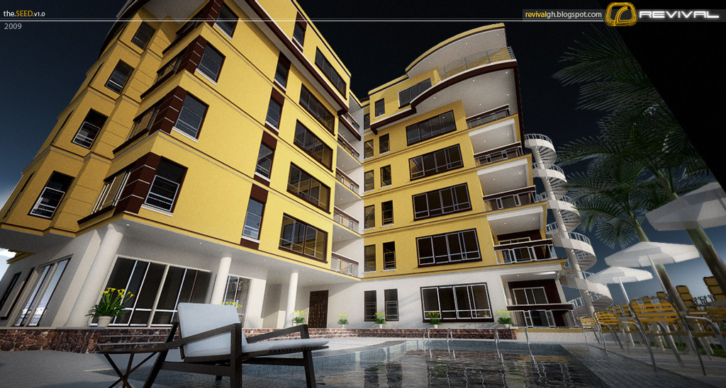 The courtyard between the two wings seen from ground level: ochre walls with dark brown banding and deep-set windows, balconies stepping up both faces, a paved pool deck with a shaped swimming pool, three striped parasols and a line of palms along the far fence, and two lounge chairs in the foreground.