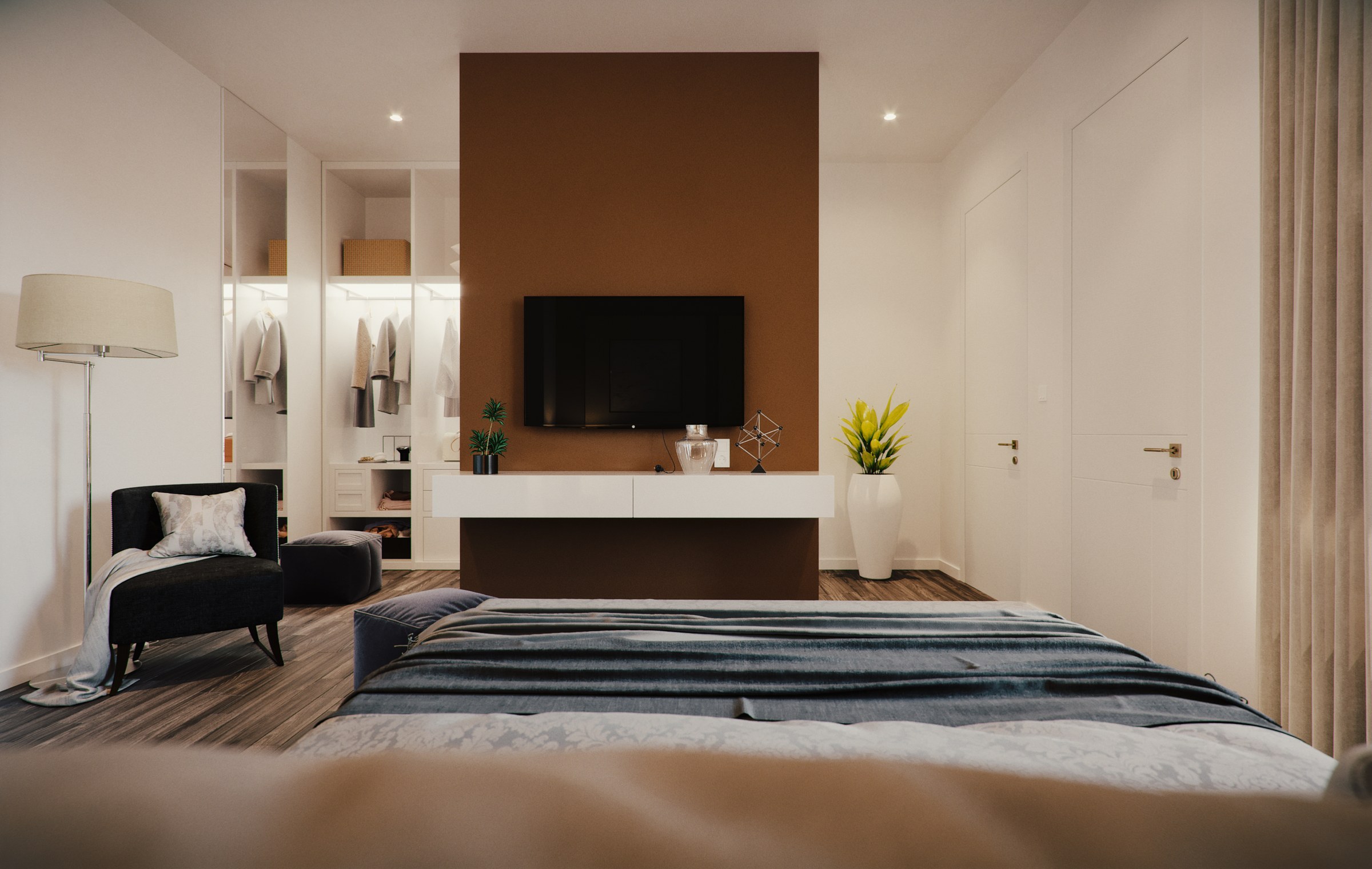 A rendered master bedroom, the bed facing a tall brown feature panel with a wall-mounted television and a low white console. An open walk-in wardrobe with hanging clothes is visible to the left, with a dark armchair, floor lamp and framed art.