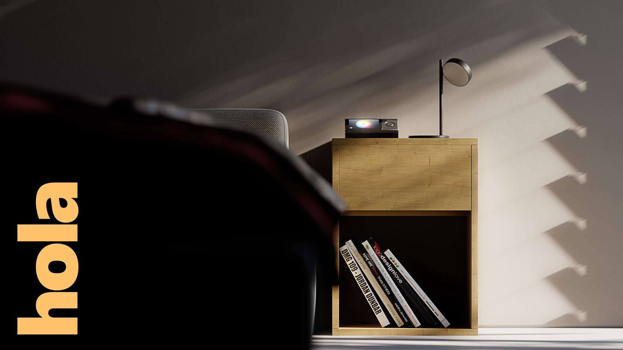 Hola nightstand in light oak with an open lower shelf of paperbacks, a black disc lamp and a colour-wheel screen device on top, blind shadows on a grey wall, vertical hola lettering at the left.