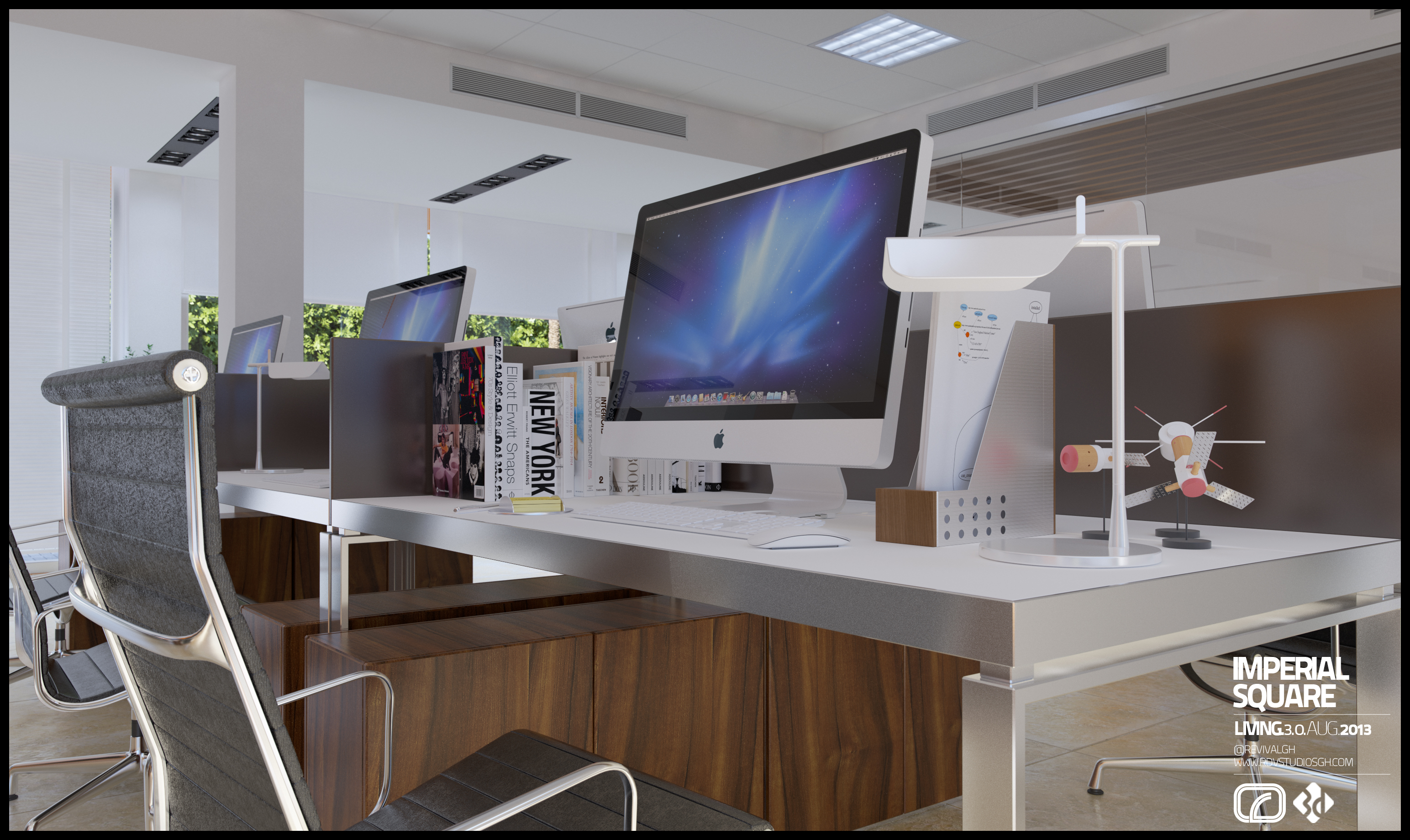Imperial Square desk close-up: desktop computer with blue wallpaper, a white lamp, art books stood as dividers with a NEW YORK spine, grey task chair and wood pedestal