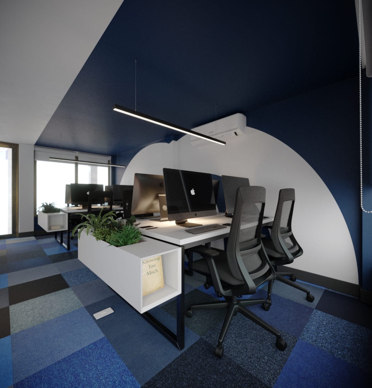 Margin Bank open-plan workstations: desktop computers and grey mesh chairs on white desks under a linear pendant, a navy ceiling and a white disc painted on the wall behind, a planter divider at the bank's end holding a face-out copy of Knowing Too Much.