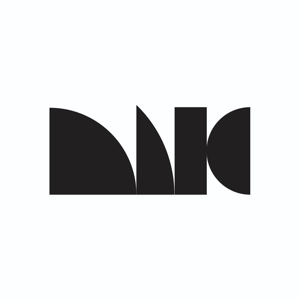 MIG logotype: four solid black shapes in a row on white, a quarter-circle with a curved upper edge, a narrow wedge, a tall rectangle and a half-circle with its flat side to the left, reading as an abstract monogram.