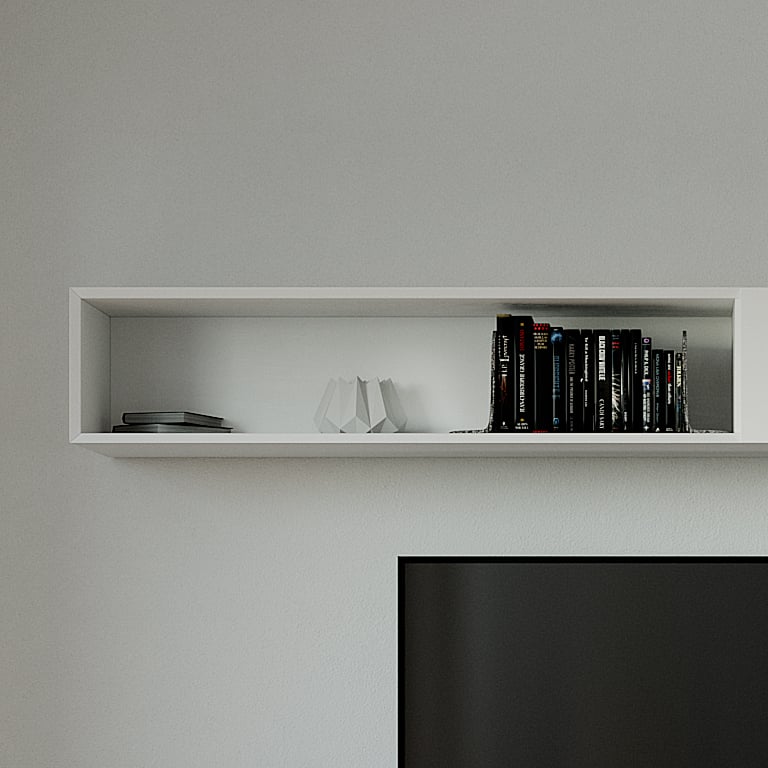 Detail of the white wall shelf above the console, its open bay holding books and a folded paper ornament.
