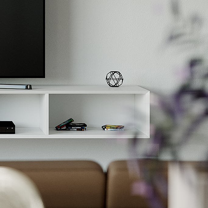 Detail of the white unit&rsquo;s open bay with discs and a media player, a black wire ornament on the top.