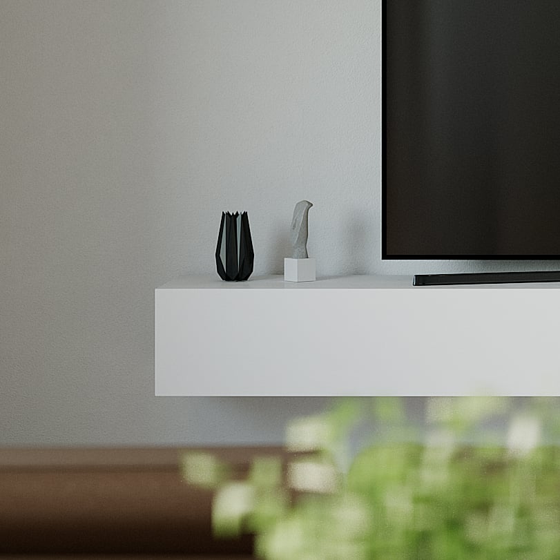 Detail of the white unit&rsquo;s end with a black faceted vase and a grey sculpture beside the screen.