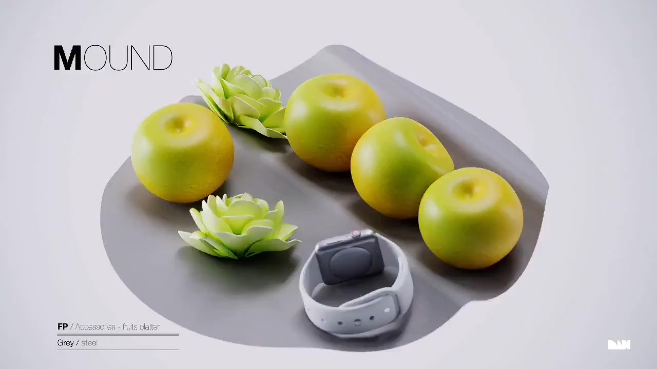 Labelled MOUND plate: a shallow grey tray carrying fruit and a wristwatch.