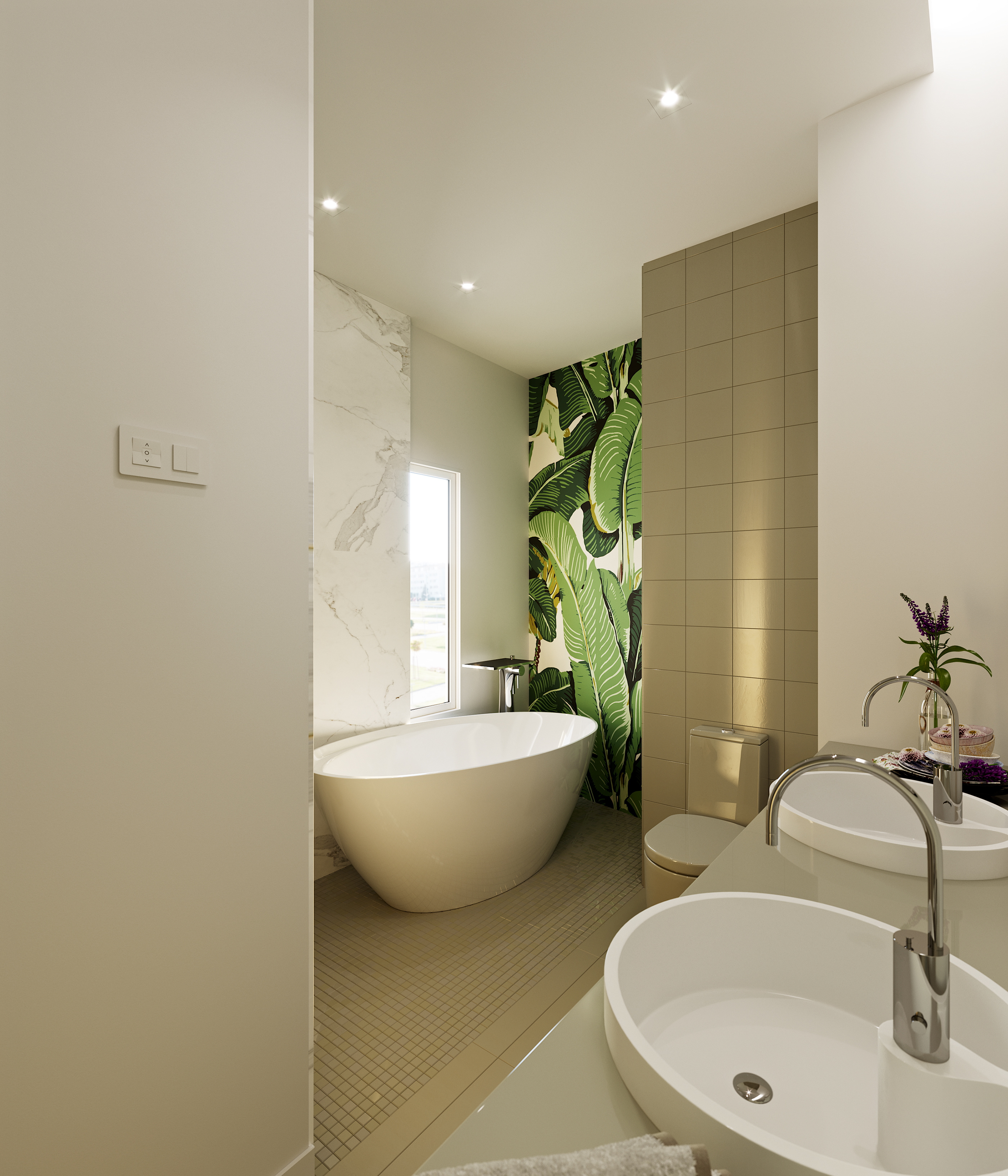 Naadei Villas bathroom: oval freestanding tub on a tiled platform before a narrow window, banana-leaf wallpaper panel behind, and a close-coupled WC beside a twin-vessel vanity.
