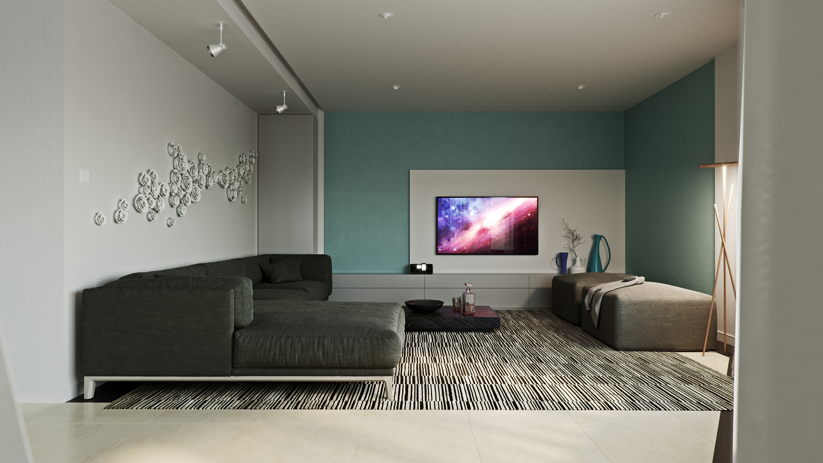 Naadei Villas media room: dark sectional and low ottoman bench on a striped rug facing a wall-mounted TV set into teal panelling, ceramic rose relief climbing the wall at one side.
