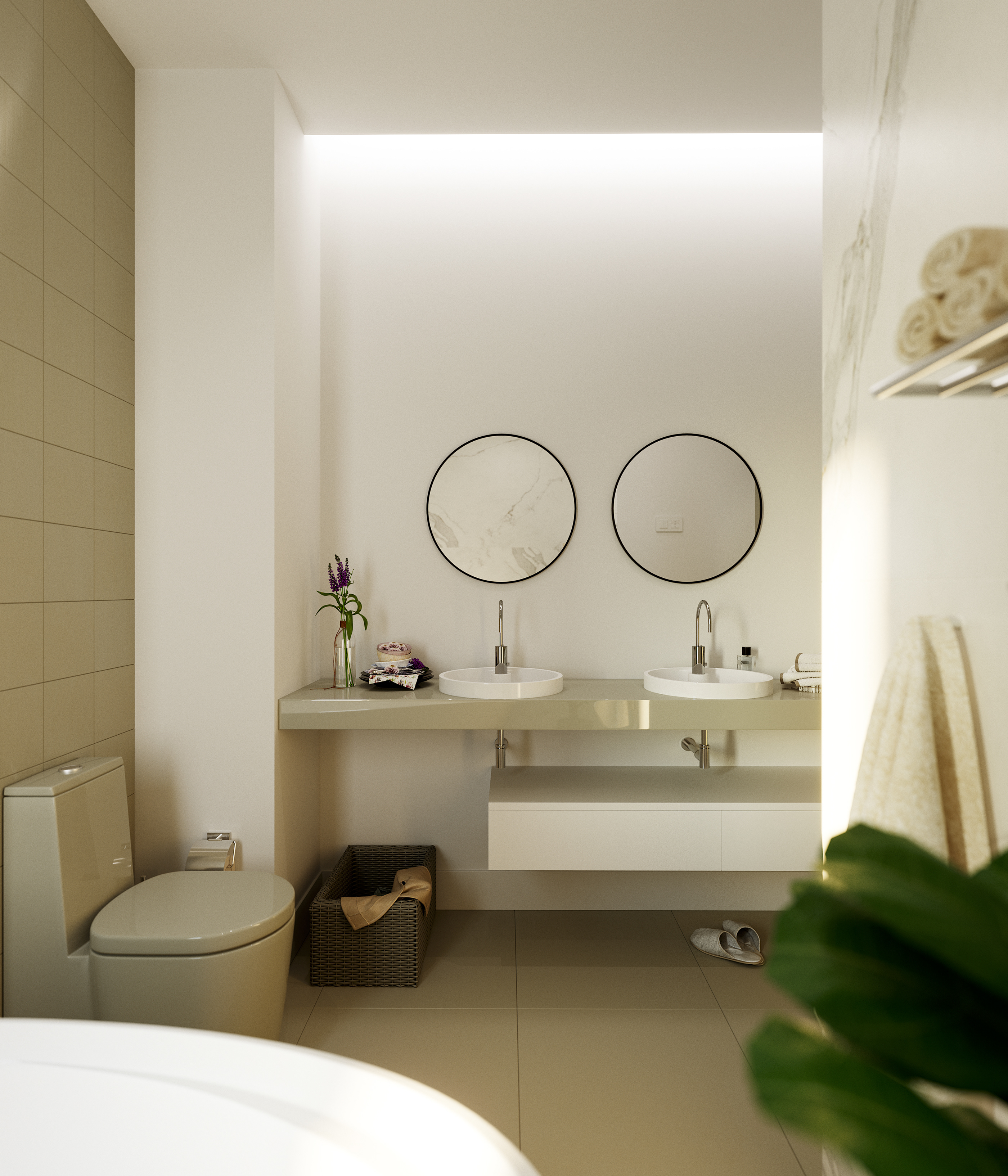 Naadei Villas vanity wall: floating beige counter with two white vessel basins and slim chrome taps under round black-framed mirrors, rolled towels on a rail and the tub rim in front.