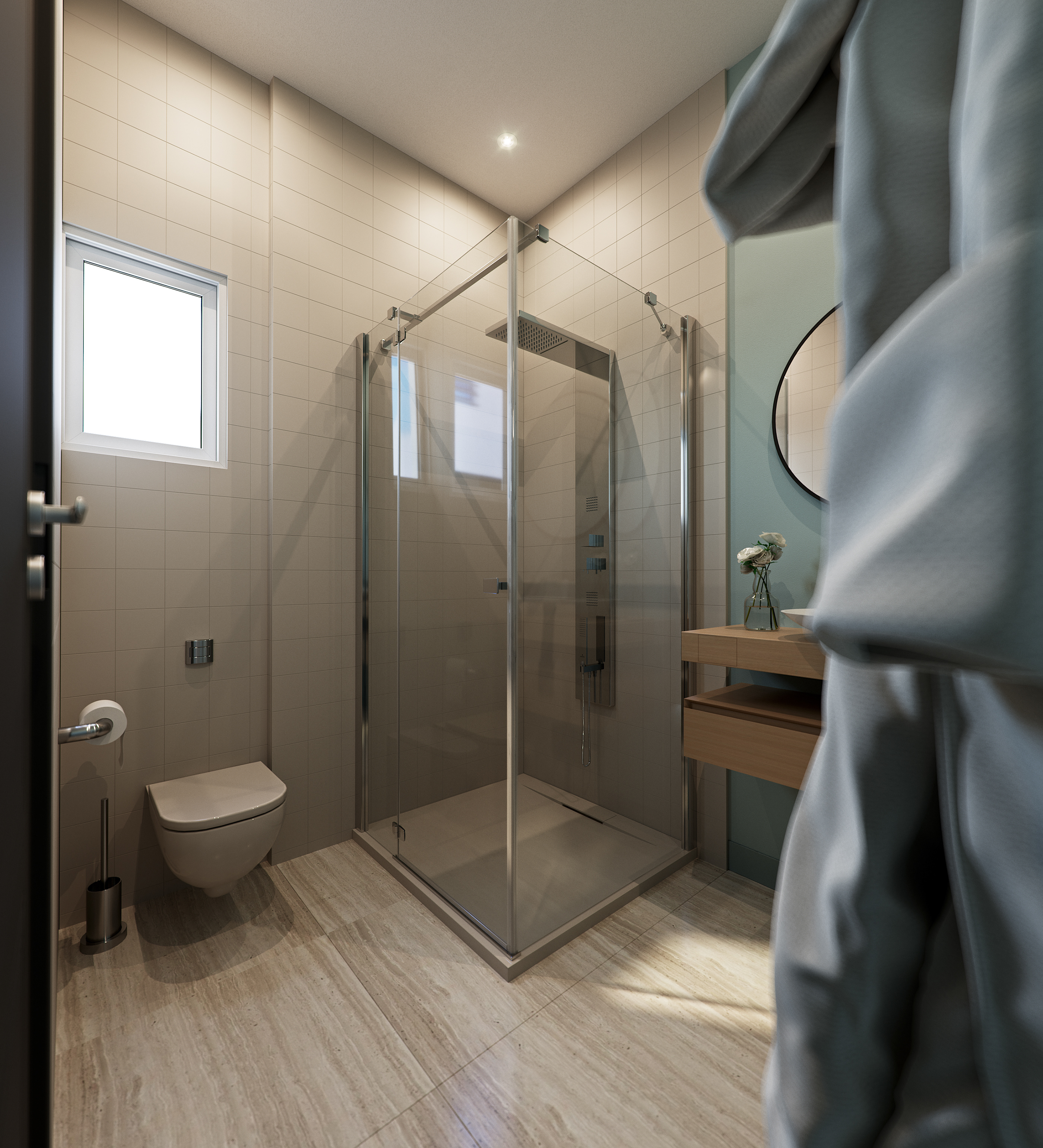 Naadei Villas shower room past a hanging robe: frameless glass enclosure with a square rainhead on a low tray, wall-hung WC under a small window and a floating oak vanity against a green wall.