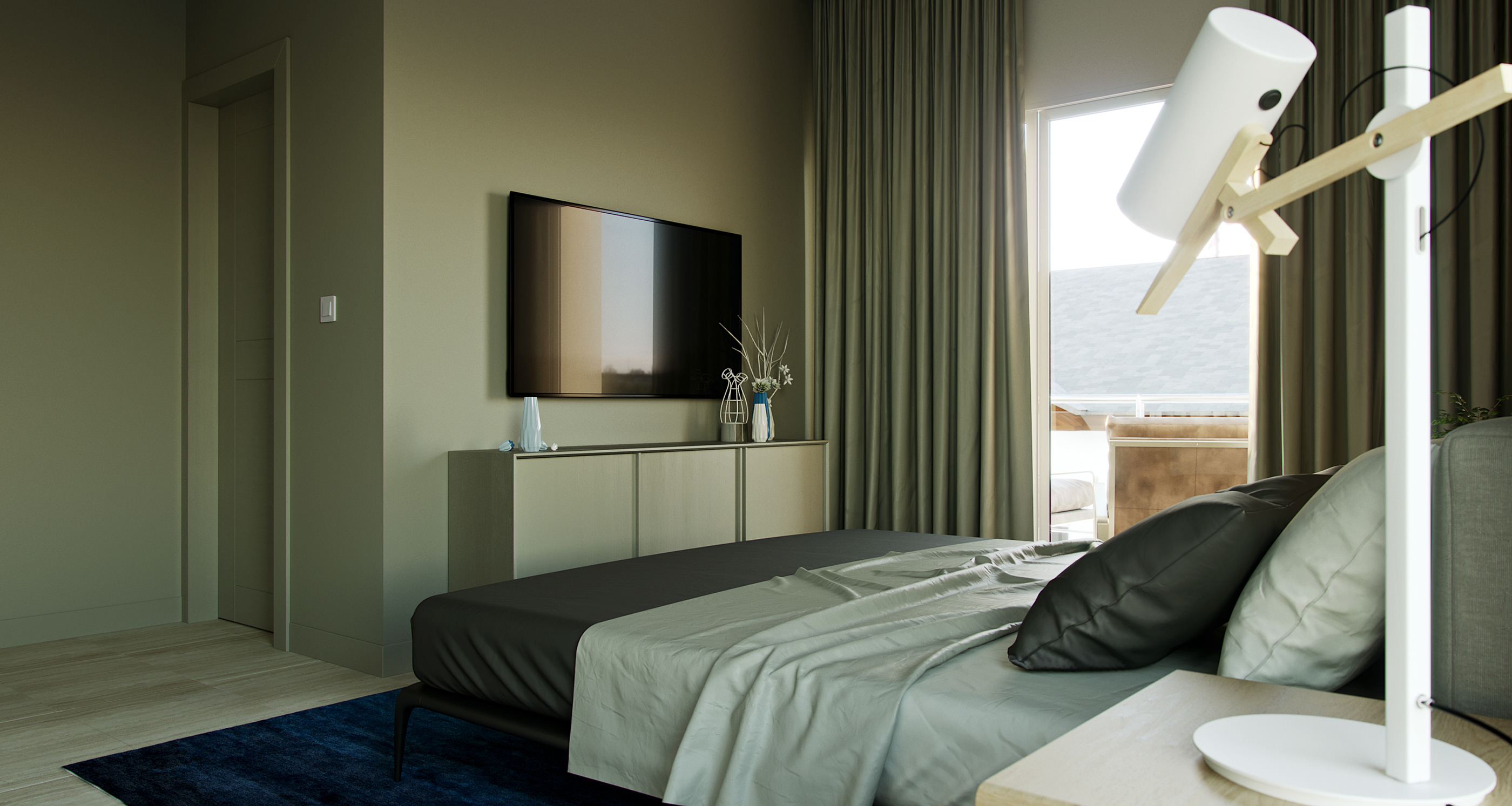 Naadei Villas bedroom: low bed in charcoal and pale sage linen on a deep blue rug, wall-mounted TV above a pale sideboard, olive curtains framing a glazed balcony door.