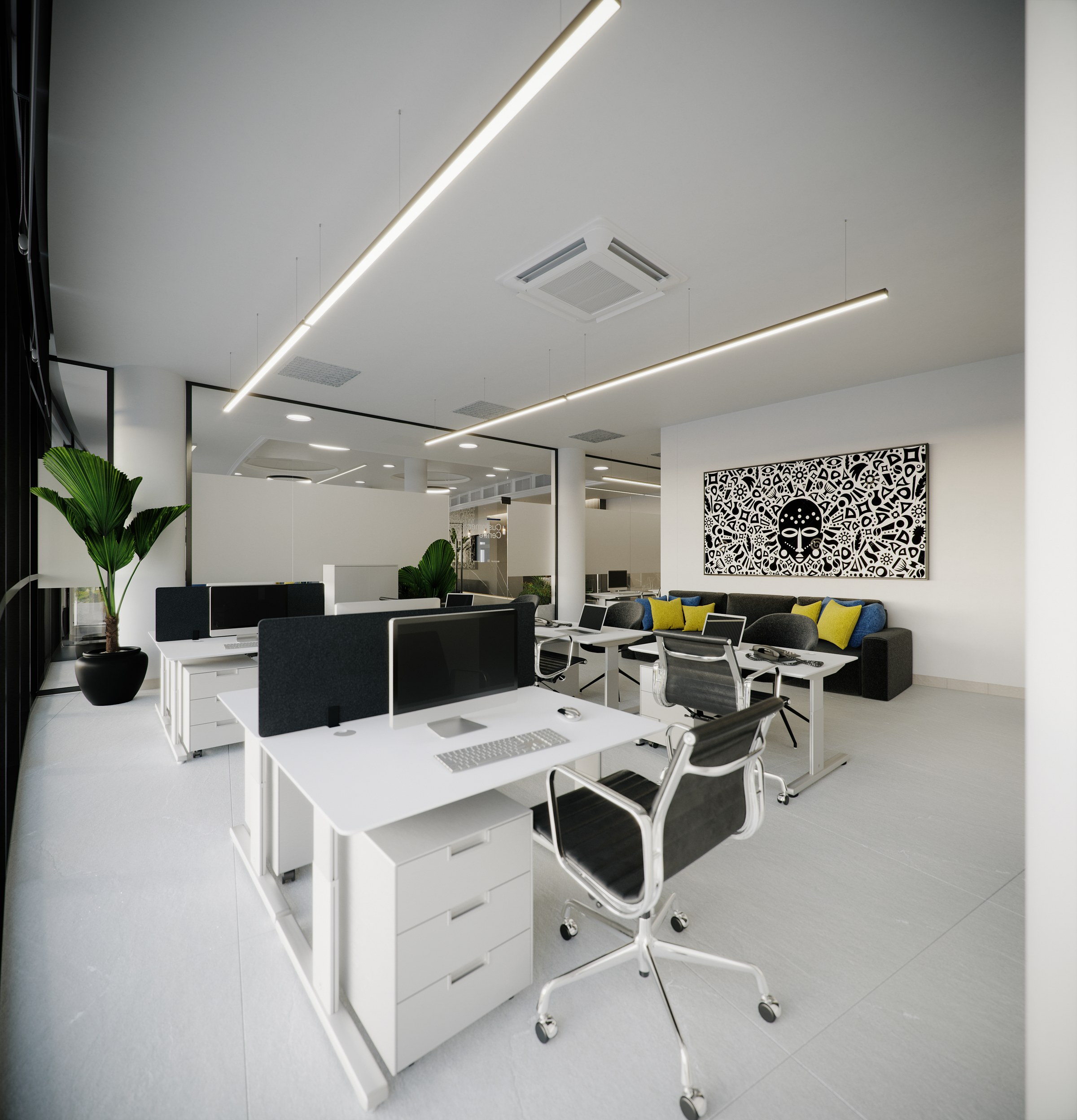 NPA - open-plan office: white bench desks with black acoustic screens, the laser-cut eagle panel and a grey sofa with blue and yellow cushions