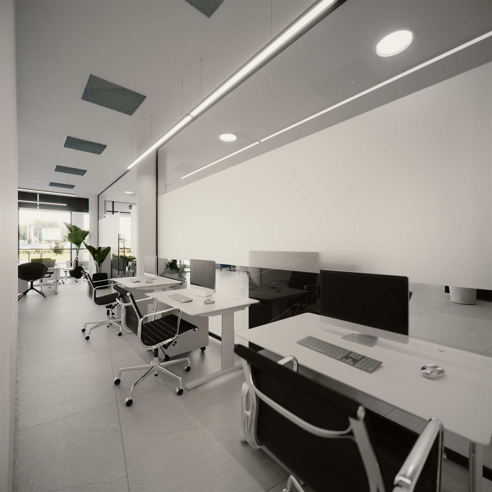 The meeting end of the floorplate: a black-framed glazed meeting room with a felt-lined door and a grey felt pinboard, and a row of desks with black leather chairs on the near side.